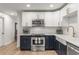 Beautiful updated kitchen features stainless appliances, navy cabinets, gold hardware and farmhouse sink at 1105 Clairemont Ave # O, Decatur, GA 30030