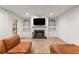 Inviting living room with fireplace, built-in bookshelves, hardwood floors, and a cozy seating area at 1105 Clairemont Ave # O, Decatur, GA 30030