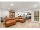 Spacious open concept living area with an eat-in kitchen featuring white cabinets and a large island at 1105 Clairemont Ave # O, Decatur, GA 30030