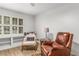 Bright living room with hardwood floors, white trim, and a cozy reading nook at 1105 Clairemont Ave # O, Decatur, GA 30030
