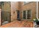 Brick patio with an iron gate, providing a secure and stylish outdoor space next to the building at 1105 Clairemont Ave # O, Decatur, GA 30030
