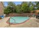 Outdoor pool area surrounded by lush greenery, perfect for summer fun and relaxation at 1105 Clairemont Ave # O, Decatur, GA 30030