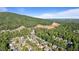 Scenic aerial view showcasing a new development nestled amidst lush greenery and a majestic mountain backdrop at 1210 Magnolia Park Cir, Cumming, GA 30040