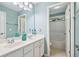 Bright bathroom features double sink vanity with white cabinets and ample countertop space at 1210 Magnolia Park Cir, Cumming, GA 30040