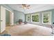 Spacious bonus room with natural lighting, neutral carpet, and high ceilings at 1210 Magnolia Park Cir, Cumming, GA 30040
