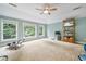 Bonus room featuring tray ceiling, lots of light, and plenty of room to exercise at 1210 Magnolia Park Cir, Cumming, GA 30040