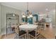 Dining area with decorative chandelier and access to other rooms at 1210 Magnolia Park Cir, Cumming, GA 30040