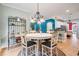 Cozy dining area featuring a round table, chandelier, and view into the living area at 1210 Magnolia Park Cir, Cumming, GA 30040