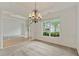 Dining room featuring chandelier and bright windows with neighborhood views at 1210 Magnolia Park Cir, Cumming, GA 30040