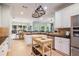 Bright kitchen features granite counters, stainless steel appliances, a pot rack, and a butcher block island at 1210 Magnolia Park Cir, Cumming, GA 30040