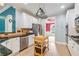 Well-equipped kitchen with stainless steel appliances and functional island with storage at 1210 Magnolia Park Cir, Cumming, GA 30040