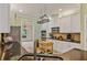 Kitchen with modern appliances, hanging rack, and granite countertops at 1210 Magnolia Park Cir, Cumming, GA 30040