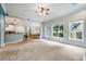 Open living room with kitchen and dining area, plus lots of natural light at 1210 Magnolia Park Cir, Cumming, GA 30040