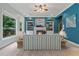A well-lit living room features a fireplace, built-in bookshelves, and a large window at 1210 Magnolia Park Cir, Cumming, GA 30040