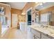 The bright main bathroom features double sinks, a soaking tub, a shower and neutral decor at 1210 Magnolia Park Cir, Cumming, GA 30040