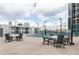 Community basketball court area with tables and chairs at 1280 W Peachtree Nw St # 3602, Atlanta, GA 30309