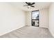 Bright bedroom with city view, large windows, and neutral carpet at 1280 W Peachtree Nw St # 3602, Atlanta, GA 30309
