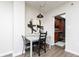 Cozy dining area with a modern pendant light and view of the kitchen at 1280 W Peachtree Nw St # 3602, Atlanta, GA 30309