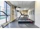 Well-equipped gym with treadmills, large windows, and mounted TVs at 1280 W Peachtree Nw St # 3602, Atlanta, GA 30309