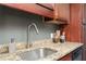 Detailed view of the kitchen with granite countertops and a stainless steel sink at 1280 W Peachtree Nw St # 3602, Atlanta, GA 30309