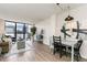 Inviting living room with a city view, adjacent to dining area at 1280 W Peachtree Nw St # 3602, Atlanta, GA 30309