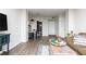 Open-concept living space with sleek flooring, dining area, and a glimpse of the well-equipped kitchen at 1280 W Peachtree Nw St # 3602, Atlanta, GA 30309