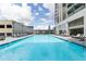 Relaxing outdoor pool area with ample lounge seating and sunny skies at 1280 W Peachtree Nw St # 3602, Atlanta, GA 30309