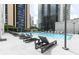 Resort-style pool area with comfortable lounge chairs and city views at 1280 W Peachtree Nw St # 3602, Atlanta, GA 30309