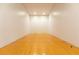 Indoor racquetball court with well-maintained wooden floors and white walls at 1280 W Peachtree Nw St # 3602, Atlanta, GA 30309