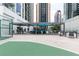 Community pool, lounging, and tennis court area at 1280 W Peachtree Nw St # 3602, Atlanta, GA 30309