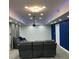 Finished basement with movie screen and leather furniture at 4520 Essen Lane, Cumming, GA 30041