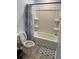 Bathroom featuring a shower-tub combo and patterned shower curtain at 4520 Essen Lane, Cumming, GA 30041