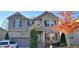Charming two-story brick home with a well-manicured front yard and attached two-car garage at 4520 Essen Lane, Cumming, GA 30041