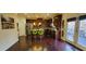 Open kitchen with hardwood floors, stainless appliances, and an island with seating at 4520 Essen Lane, Cumming, GA 30041