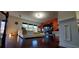 Open-concept living room with hardwood floors and modern furniture at 4520 Essen Lane, Cumming, GA 30041