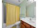 Bathroom with combined shower and tub, vanity, light fixtures and neutral colors at 2656 Avanti Way, Decatur, GA 30035