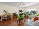 Cozy living room with hardwood floors, fireplace, lots of plants, and ceiling fan at 2656 Avanti Way, Decatur, GA 30035
