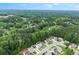 Aerial view of a community surrounded by lush green trees at 336 Parc Xing, Acworth, GA 30102