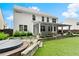 Expansive backyard featuring a covered patio, a hot tub, and artificial turf at 336 Parc Xing, Acworth, GA 30102