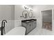 Elegant bathroom with double vanities, soaking tub, and hardwood floors at 336 Parc Xing, Acworth, GA 30102