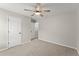 Neutral bedroom with a ceiling fan, a door, and carpet at 336 Parc Xing, Acworth, GA 30102