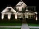 A beautifully lit two-story home boasts curb appeal with a manicured lawn and inviting entrance at 336 Parc Xing, Acworth, GA 30102
