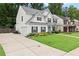 Inviting two-story home with a lush green lawn and a spacious driveway leading to the attached garage at 336 Parc Xing, Acworth, GA 30102