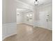 Inviting living room with a large window, modern light fixture, and updated flooring at 336 Parc Xing, Acworth, GA 30102