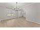 Spacious living room with archways, a view to the entryway and modern light fixture at 336 Parc Xing, Acworth, GA 30102