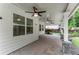 Covered back patio with brick pavers, white columns and ceiling fans at 336 Parc Xing, Acworth, GA 30102