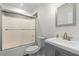 Standard bathroom featuring a shower with sliding doors, a toilet, and a vanity sink at 966 Crest Ridge Sw Dr, Marietta, GA 30060