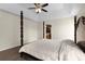 Main bedroom features trey ceilings, a ceiling fan, hardwood floors, and a king-sized bed at 966 Crest Ridge Sw Dr, Marietta, GA 30060