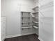 A bedroom closet featuring white trim and multiple levels of storage solutions at 966 Crest Ridge Sw Dr, Marietta, GA 30060