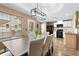 Stylish dining area features modern lighting and a view into the kitchen at 966 Crest Ridge Sw Dr, Marietta, GA 30060